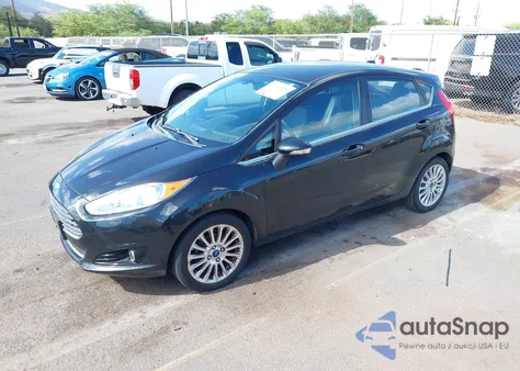 2014 Ford Fiesta Titanium z USA, uszkodzony, nr VIN 3FADP4FJ2EM133695